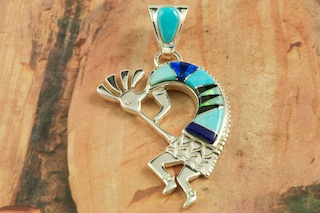 Stunning Kokopelli Pendant featuring Genuine Sleeping Beauty Turquoise, Black Jade and Blue Lapis inlaid between ribbons of Sterling Silver. Beautiful Fire and Ice Lab Opal Accents. Precision inlay on the bale and the pendant. Free 18
